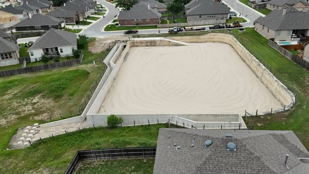 Aerial drone view of a San Antonio detention basin under maintenance.